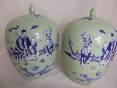 Pair of celadon ginger jars depicting various characters within a garden, approx. 30 cms. high (2)