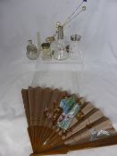 A misc. collection of cut glass perfume and other bottles incl. an ebony silver topped treen