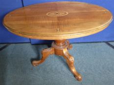 A Sheraton Style Tilt Top Supper Table being on a bulbous base with three ornate splayed feet, the