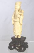 Chinese Ivory Figure, the figure depicts a courtier on a rose wood plinth. (waf)