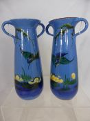 A pair of Torquay Pottery Vases hand painted with Kingfisher diving into a pond, 26 cms h.