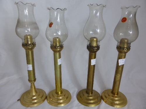 Four Indian Brass and Gemini Glass Lamps, labelled Andhra Kurnool.