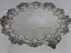 A Victorian Solid Silver Card Tray, the tray having an ornate scalloped edge depicting flowers and