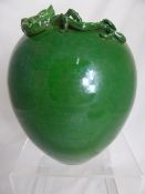 Chinese green porcelain ovoid Daoguang vase having applied dragon and bar, approx. 22 cms high.