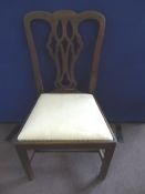 Four Antique Mahogany Dining Chairs having lyre backs and being in the Chippendale style.