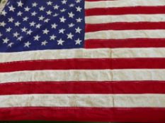 A Stars and Stripes American Flag by The Valley Forge Flag Co. Spring City PA. approx. 134 x 67 cms.