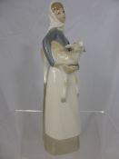 A Porcelain Lladro figure featuring young woman and her lamb together with two sleepy heads, 26