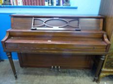 A Poole Boston 340580 upright piano having turned legs and music stand, teak cased approx. 410 x