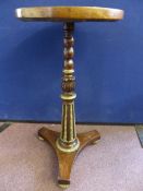 A small Victorian mahogany pedestal table, the column support having brass beading on brass feet