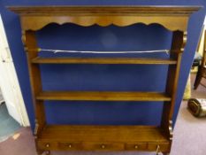 An oak plate rack having two shelves and four spice drawers and one large drawer, approx. 100 x 99 x