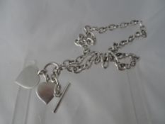 Solid silver hallmarked necklace with heart pendant in a Tiffany box with felt sleeve.