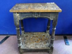 An Antique Ornately Carved Occasional Table having turned legs and an under shelf, approx. 44 x 24 x