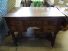An Antique Kneehole Buffet Style Mahogany Desk having two drawers to each side and a dummy drawer to