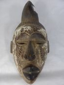 West African Punu Face Mask, depicting a warrior with carved headdress, hand painted, 36 cms.