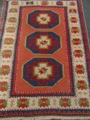 A Woollen Turkish Style Hall Rug, the rug having salmon pink, lime green and blue background 145 x