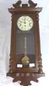 A Reproduction Wall Clock in the style of a Vienna Regulator in a mahogany effect case.