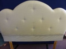 An upholstered headboard of decorative gingham material, pink and cream colouring, approx. 162 cms.