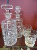 Two Cut Glass Decanters together with a pair of whisky tumblers.