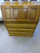 An oak bureau having three drawers with pigeon hole to the interior, approx. 80 x 42 x 96 cms.