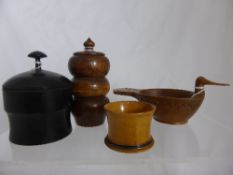 Two Wood Turned Storage Jars, together with a wooden dish in the form of a duck and a treen egg cup.