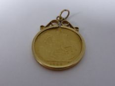 1899 half gold sovereign in a mount
