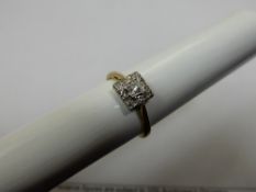 A Lady`s 18ct White and Yellow Gold Diamond Cluster Ring, 1 x 8 pts. dia. 12 x 1.1 pts, 8 cuts