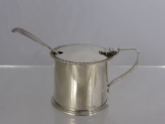 A Solid Silver Mustard, in the form of a lidded tankard having a ribboned edge, dated 1913 / 14,