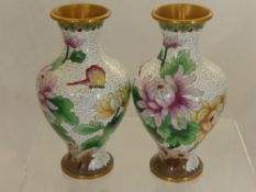 A Pair of White Cloisonne Vases depicting flowers, approx. 21 cms. high.