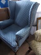 Blue and Gold Upholstered Wing Back Chair.
