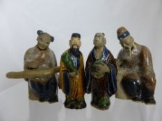 Chinese Ceramic Figure, the seated Oriental man together with two resin figures of Chinese elders