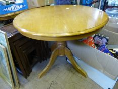 Circular Pine Breakfast Table, with four pine spindle back chairs.