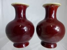 Two Chinese Flambe-glazed vases, 13.5 cms. (2)