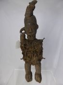 West African Vodun carved wooden hunting idol, the character having a roped form body, fixed with