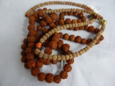 Two Chinese chestnut necklaces.