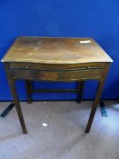 An Antique Mahogany Occasional table having inlaid banding to the top with a serpentine front with a