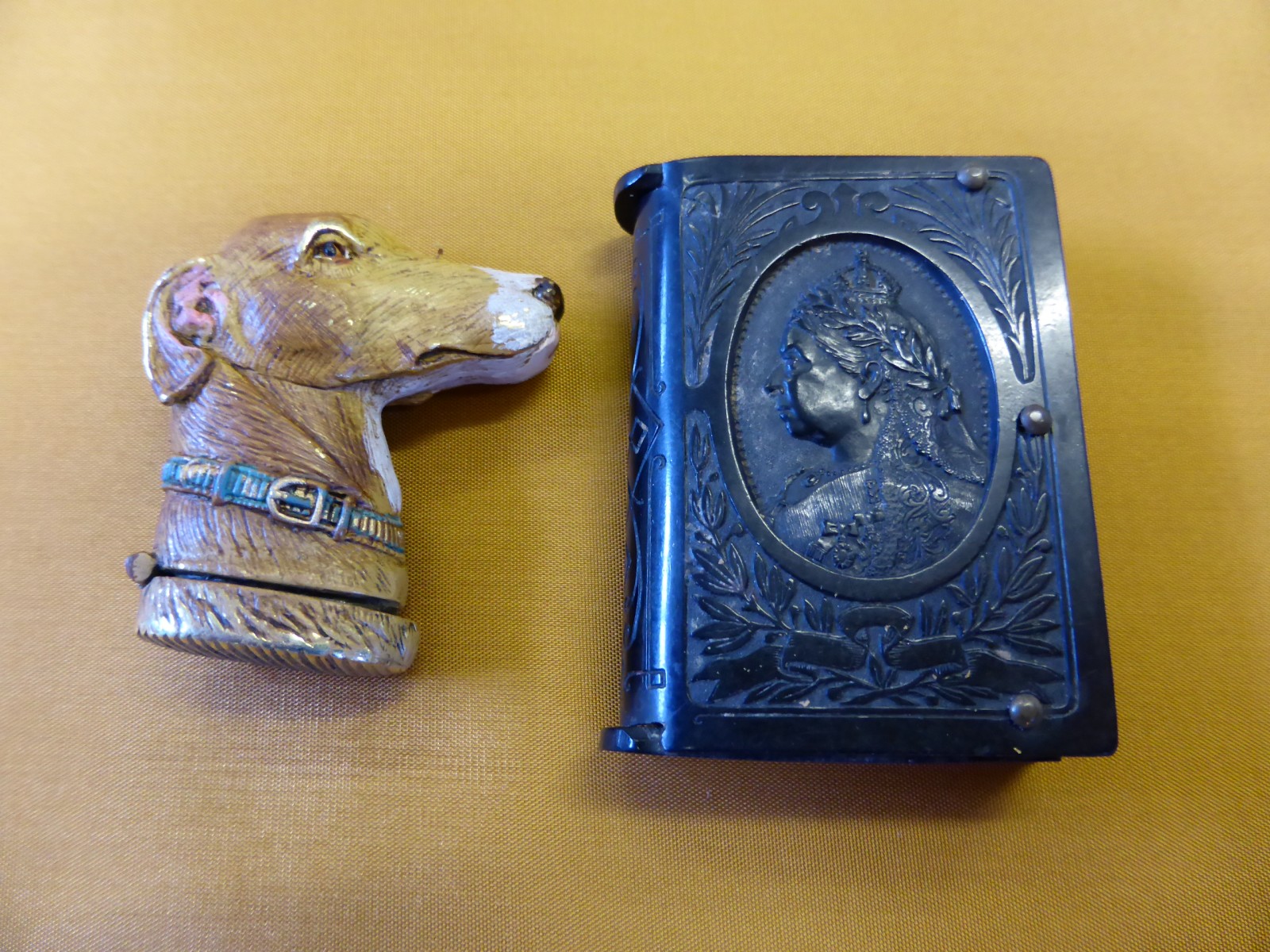 Two Vestas depicting a Cold Painted Bronze Hunting Hound together with Vulcanite with Queen Victoria