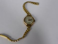 Lady`s Lanco 9 ct gold watch on a strap.