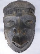 Antique Polynesian Face Mask, the mask depicting a warrior with carved head dress and chin band.