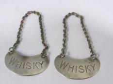 Two solid silver whisky decanter labels, Birmingham hallmarked, dated 1935 / 36, mm Nock & Newman