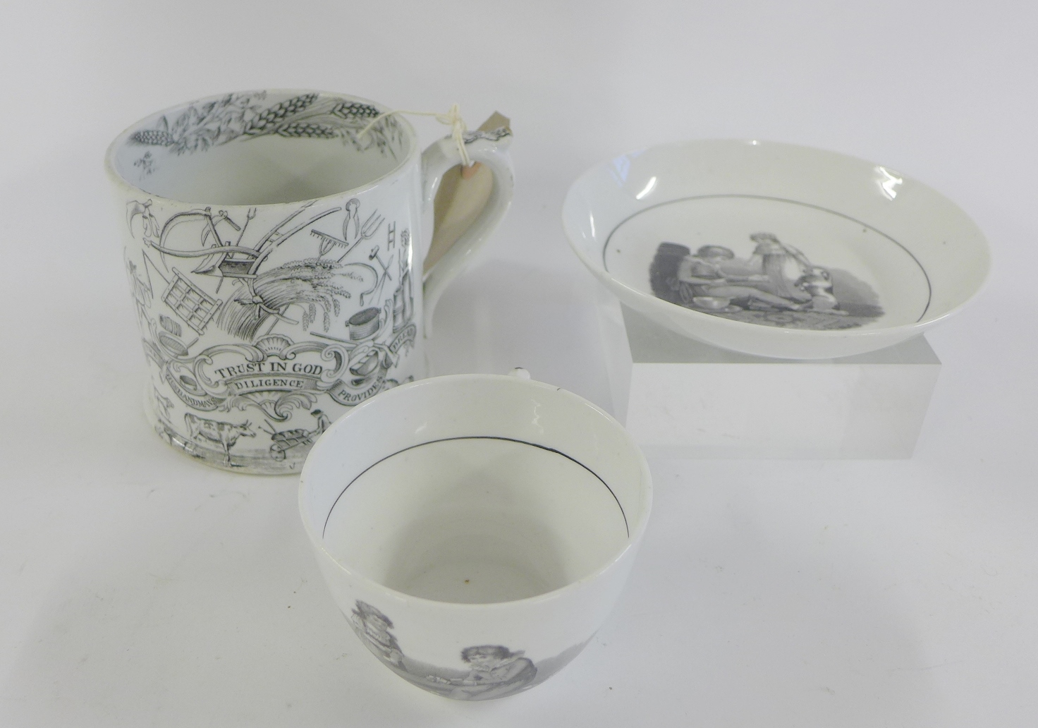 19th century Staffordshire mug transfer decorated in black and white `Trust in God, the Husbandman`