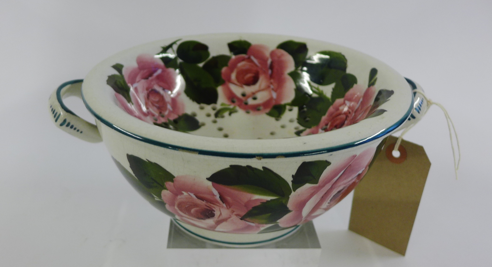 Wemyss sponge dish and drainer painted with cabbage roses, impressed marks and printed T. Goode &