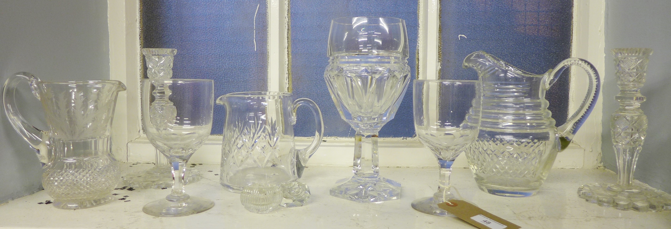 A collection of cut glass and crystal to include candlesticks, wine glasses and jugs (10)