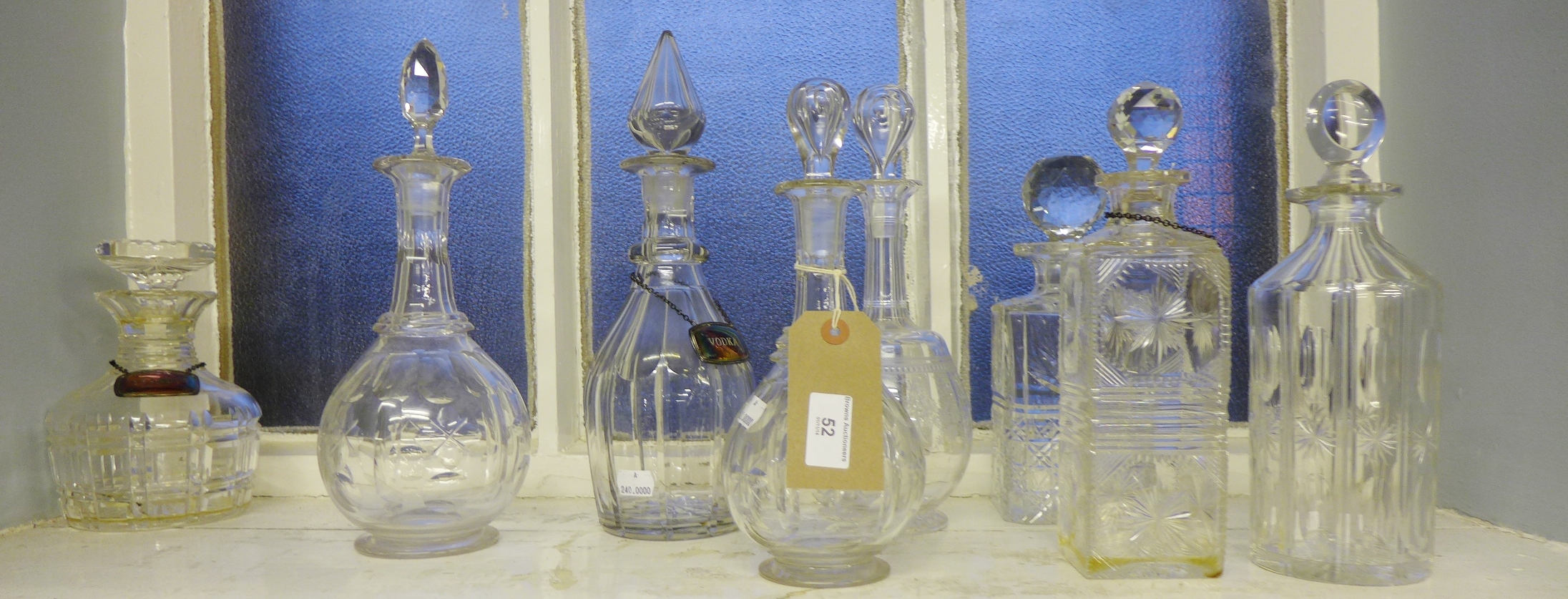 A collection of eight various cut glass and crystal decanters (8)