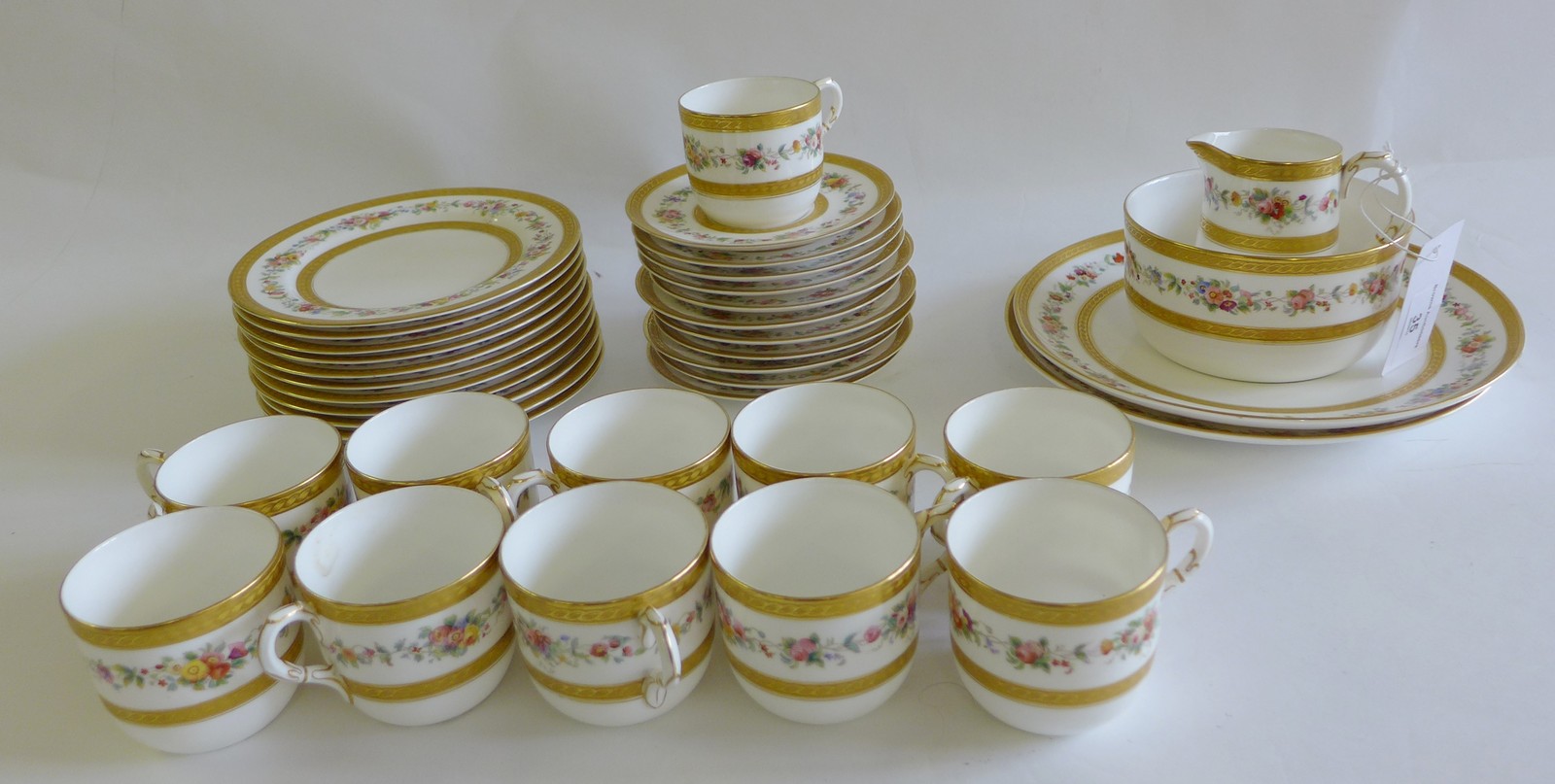 Royal Worcester hand painted floral and gilt teaset comprising eleven cups, eleven saucers, eleven