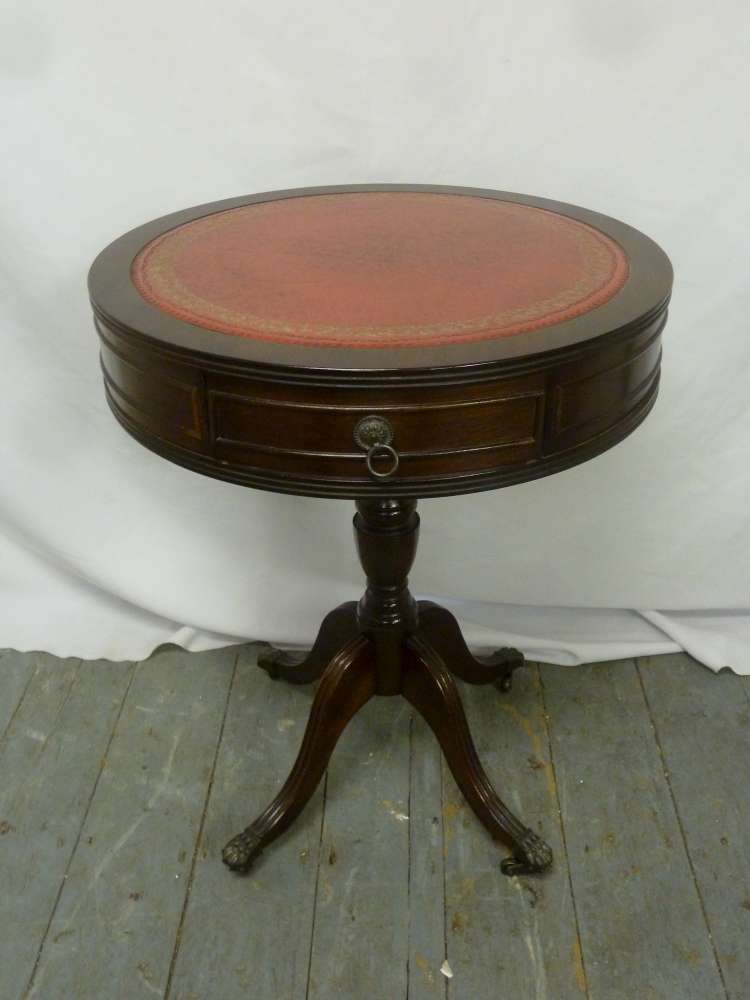 Mahogany leather top occasional table with two drawers, on four outswept feet