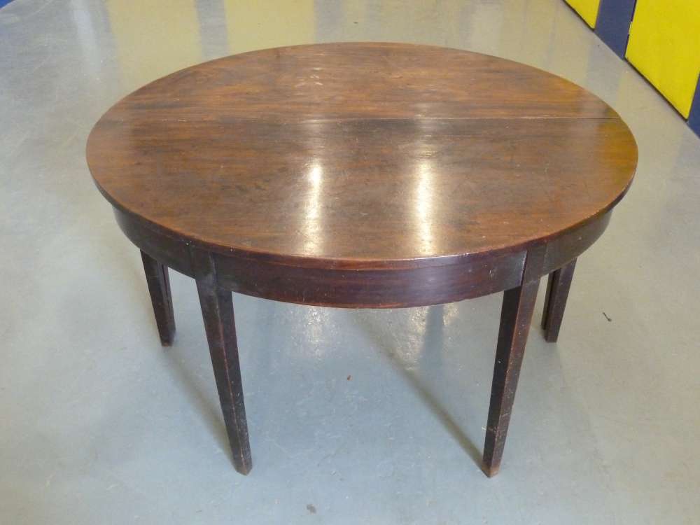 Circular two part mahogany D table, each on four tapering legs