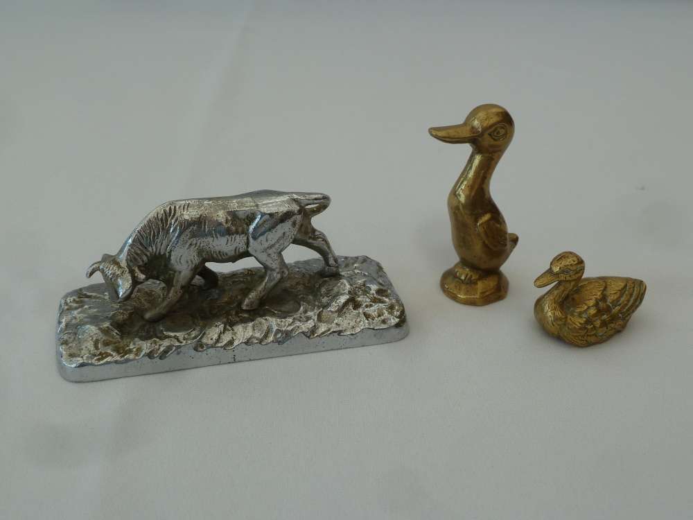 A French chrome figure of a cow and two cast bronze ducks