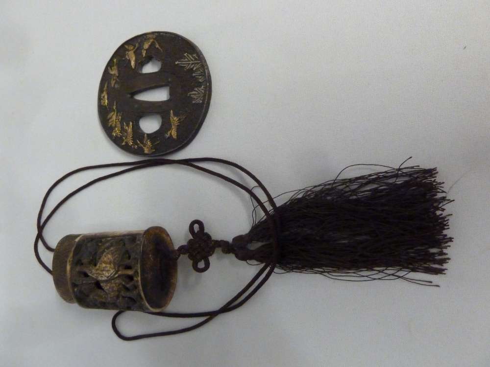 Shogun signed hilt and a carved bone Inro on a lace tassel
