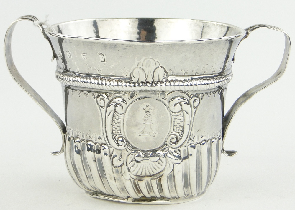 An Antique English silver 2-handled Communion cup,
with half fluted body and armorial crest,