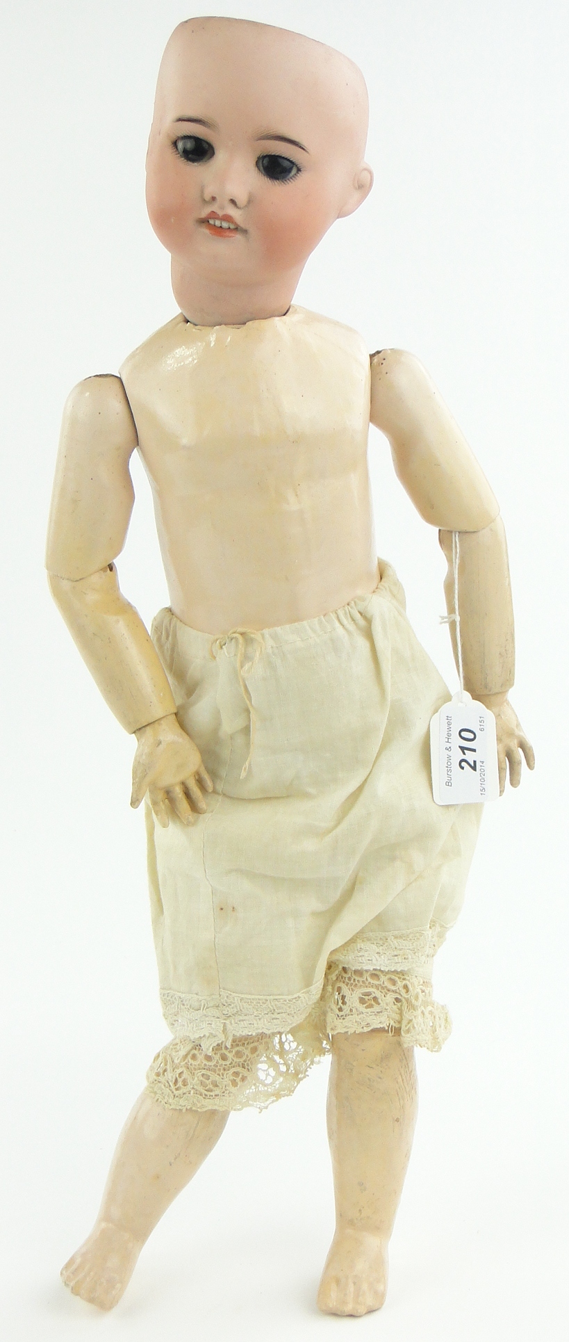 A Paris Bisque porcelain headed doll
S F B with jointed limbs, 20".